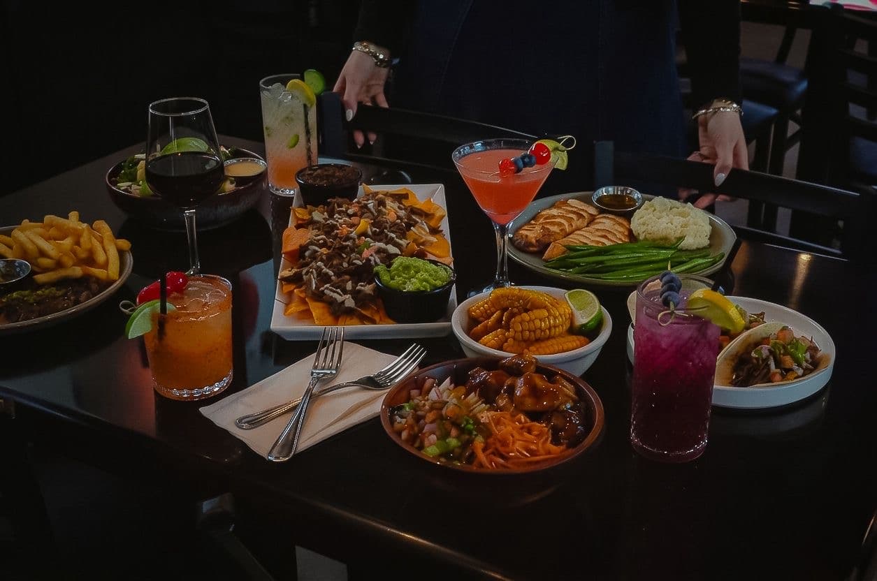 BHI Thursdays table with kosher dishes and cocktails
